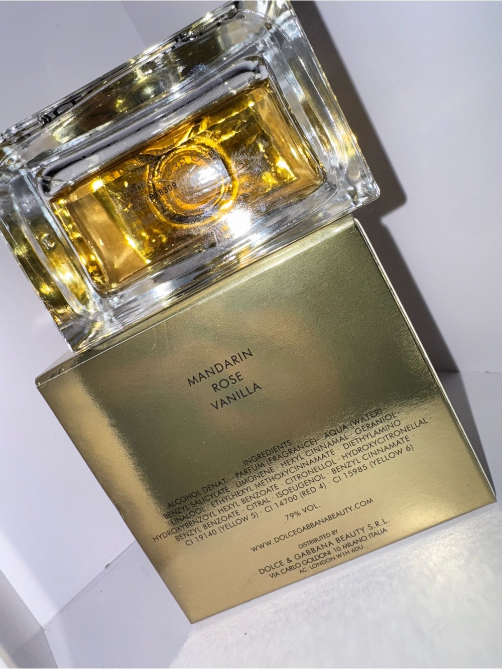 Dolce & Gabbana Gold Glass Perfume Bottle with Amber Liquid